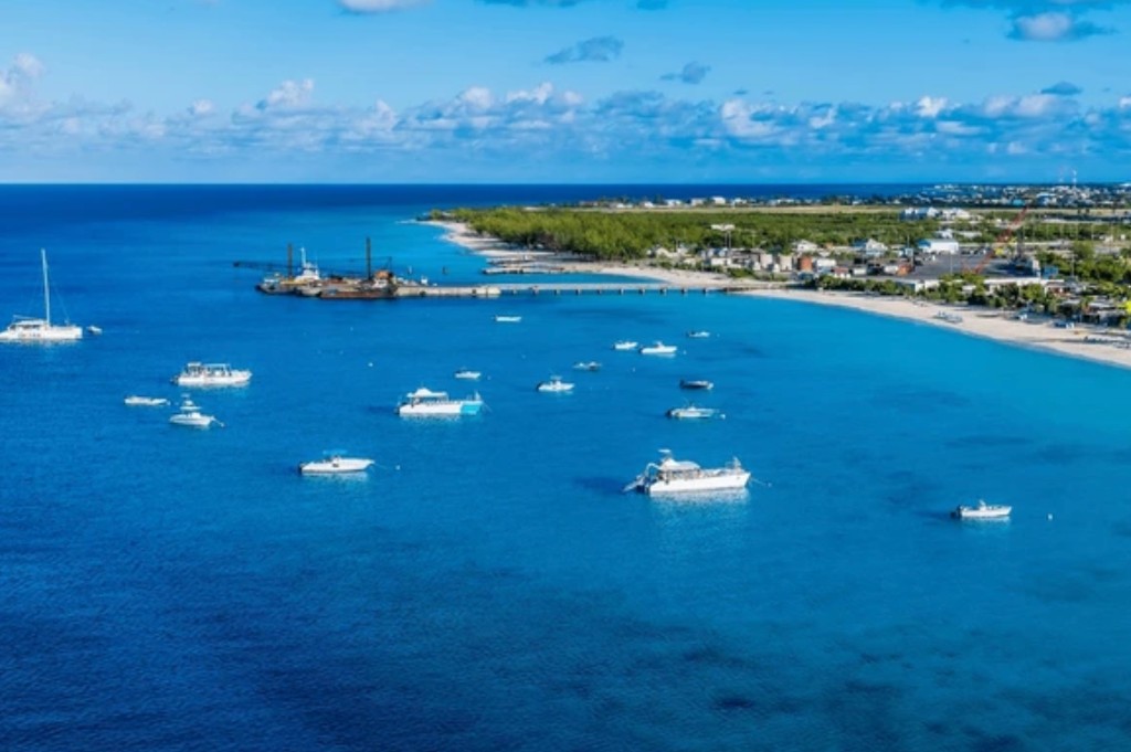 Aerial view of Grand Turk coastline with turquoise water and boats